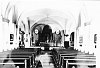 Het interieur van de St. Odiliakerk in Sweikhuizen voor de verbouwing in 1953.